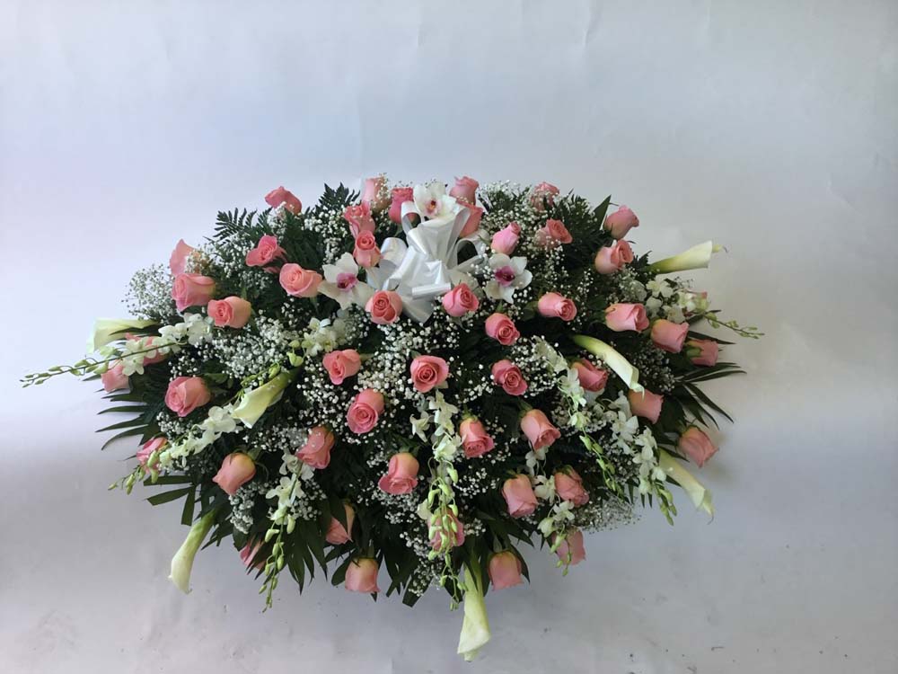 CASKET SPRAY WITH ROSES AND CALA LILLIES